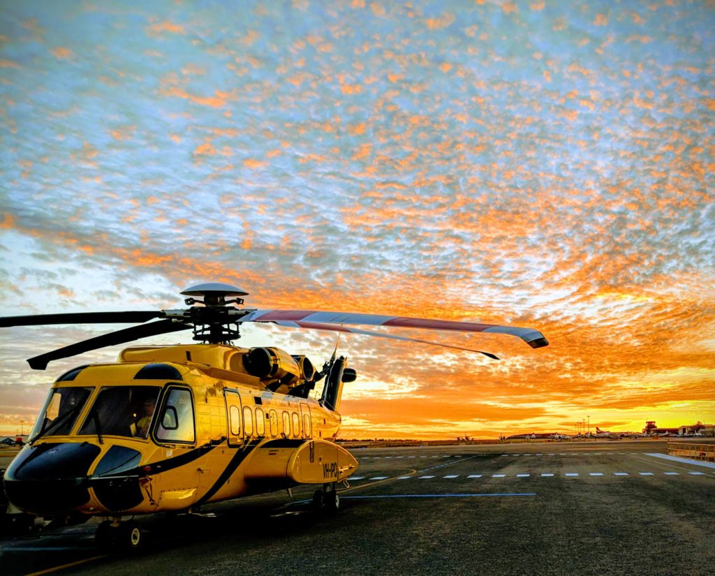 helicopter with sunset